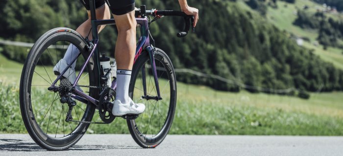 A bicyclist pedaling up a hill